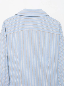 Detail of striped shirt back yoke with vertical and horizontal pattern contrast