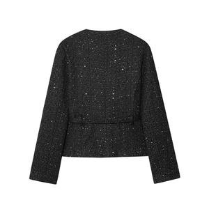 Detail of tweed fabric texture with black sequins on a short women's jacket back
