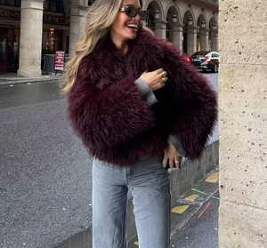 Detail of burgundy faux fur jacket texture with high density fluffy faux fur fibers