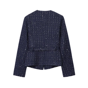 Detail view of the back of a navy tweed jacket with sparkling sequins and waist belt