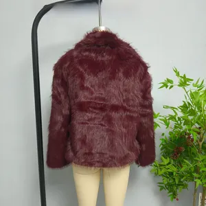 Close-up of plush burgundy faux fur jacket with stand collar and long fluffy texture