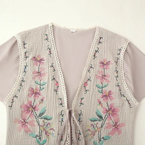 Grey cotton vest for women featuring pink floral embroidery and delicate lace edges