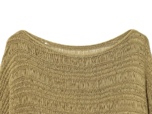 Close-up of mustard knit sweater showing hollow mesh weave and boat neck detail