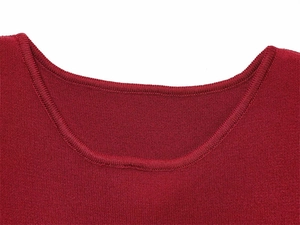 Close-up of a dark red knit neckline with high-quality stitching and smooth texture