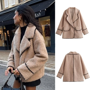 Women's light camel faux shearling jacket with black woven trim and lapel collar