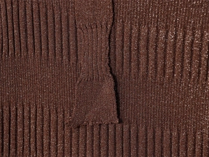Detail of brown ribbed knit fabric with metallic glitter threads and vertical texture