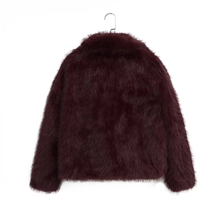 Detailed back view of a burgundy faux fur jacket showing plush texture and short design