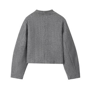 Rear view detail of dark grey short coat featuring center seam and wool texture