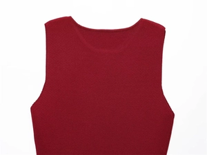 Close-up of wine red sleeveless knitted dress showing fine texture and neckline detail