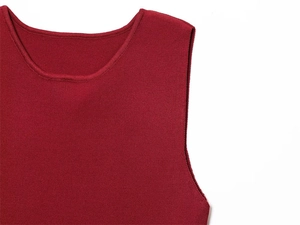 Detailed view of the crew neckline and high-density burgundy knit fabric of the dress