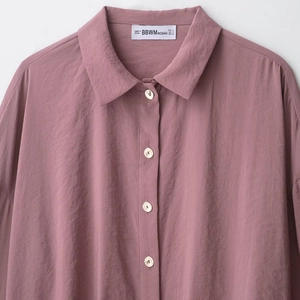Women's dusty rose long sleeve shirt with soft texture and white buttons detail