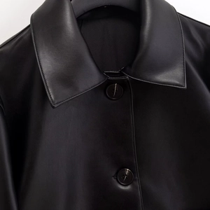 Women's black cropped faux leather jacket with lapel collar and matching buttons