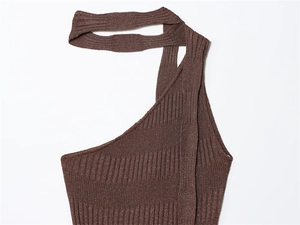 Close-up of brown ribbed knit vest featuring metallic glitter texture and asymmetric straps