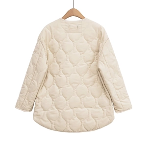 Back view of a cream quilted jacket featuring classic onion stitching and curved hemline