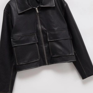 Short black faux leather jacket for women with lapel collar and large front pockets
