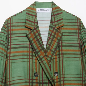 Veste de costume à carreaux verts rétro avec texture tissée et boutons en écaille
