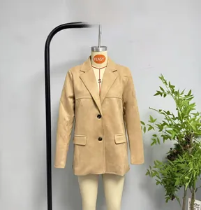 Detailed view of camel suede texture and flap pockets on longline tailored blazer jacket