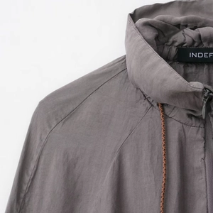 Dark grey lightweight bomber jacket with a high collar, zipper, and woven drawstrings