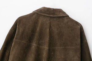 Detailed view of the dark brown faux leather jacket collar with clean stitching and texture