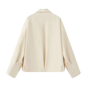 Detail view of the back of a cream white long-sleeve jacket with a modern lapel collar