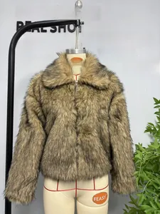 Close-up of fluffy brown faux fur jacket featuring large collar and front metal zipper
