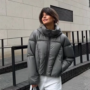 Women's grey metallic puffer jacket with hood and quilted finish in a short cropped fit