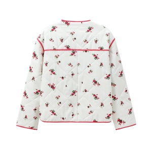 Rear view of white quilted jacket with floral print, diamond stitching and red piping