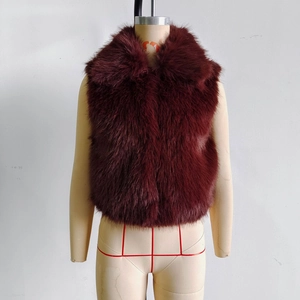 Detail of burgundy faux fur vest featuring a plush long-pile texture and wide collar