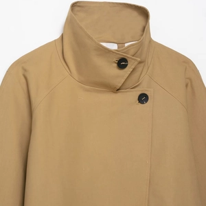 Minimalist khaki short windbreaker jacket featuring a stand collar and textured black buttons