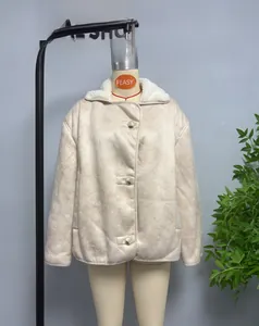 Close-up of beige faux suede jacket with white shearling lapel and large front buttons