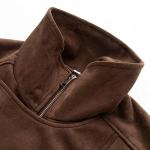 Macro shot of coffee brown suede jacket showing half-zip stand collar and fabric texture