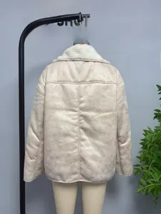 Detail view of beige faux suede jacket featuring cream faux shearling collar and drop shoulders