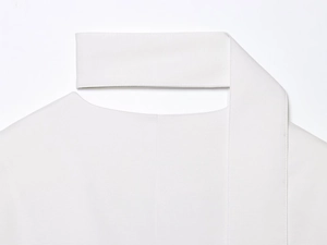 Close-up of white V-neck blazer neckline with premium fabric texture and clean stitching