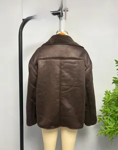 Detail view of the brown faux suede jacket back featuring sheepskin fleece lining and vertical seam