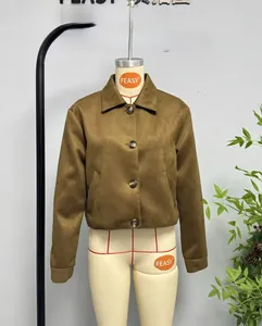 Detail of olive suede jacket with lapel collar and buttons in short utility style