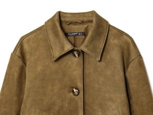 Close-up of olive brown suede jacket collar with two vintage resin buttons and fine texture