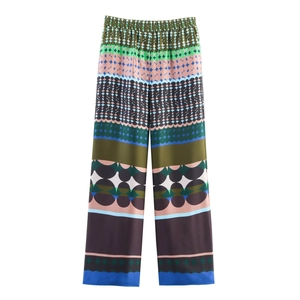 Women's satin wide-leg trousers featuring colorful geometric print and elastic waist