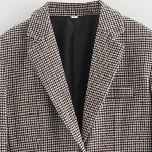 Classic houndstooth blazer jacket in black, white, and red pattern with structured shoulders