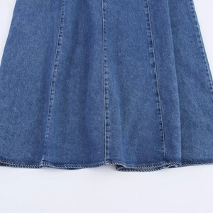 Halter backless denim dress in blue with multi-panel stitching and A-line flared hemline