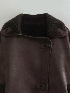 Detailed view of brown faux suede jacket featuring warm faux lamb wool collar texture