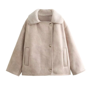 Detail of faux suede shearling jacket featuring plush collar and classic button closure