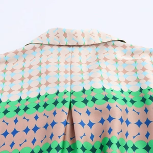 Close-up of multicolor geometric pattern and smooth silk texture on lapel shirt