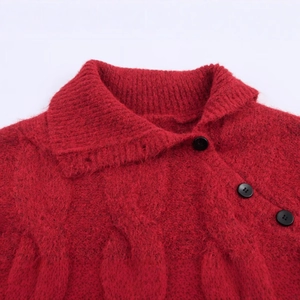 Red knit cable sweater with lapel collar and three decorative black side buttons