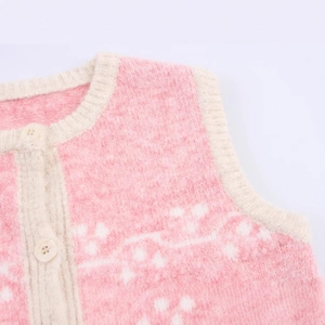 Sweet pink knitted vest with white jacquard pattern and rib knit trim detailing