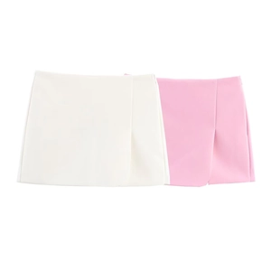 Detail showing the asymmetrical slit design of pink and white skirt shorts for women