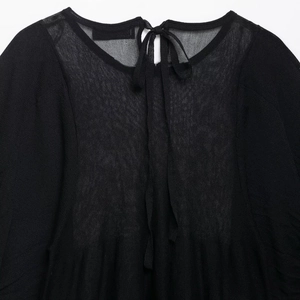 Elegant black embroidered linen top with a stylish back-tie bow and round neckline