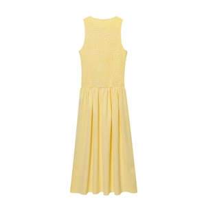 Detailed view of yellow gingham dress with smocked bodice and pleated A-line skirt