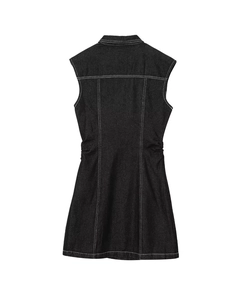 Detail view of the back of a black denim sleeveless dress with contrast white stitching