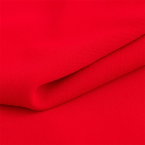 Close-up of bright red textile fabric showing soft texture and fine weave pattern