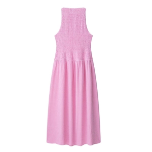 Detailed view of pink gingham dress featuring elastic smocked bodice and halter neckline